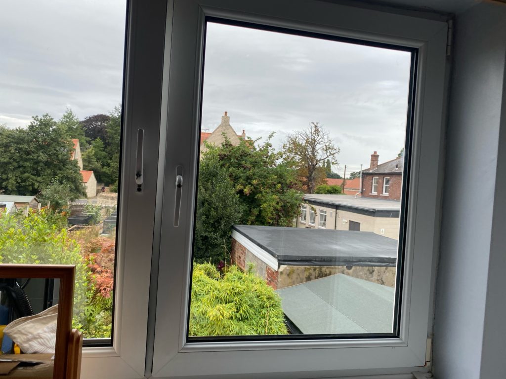 After: the same uPVC window with a new sealed unit fitted, the view through the glass now completely clear