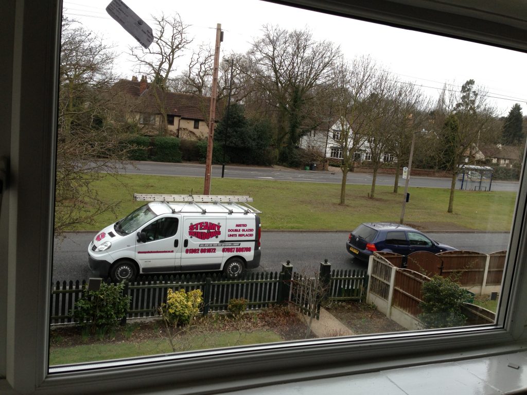 The same Doncaster street seen clearly through clear double glazing