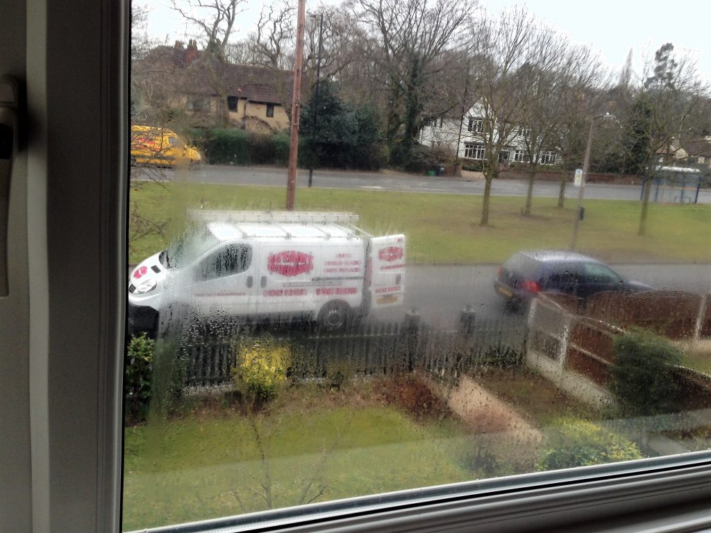 The Steamy Windows van seen through a misted up window pane in Doncaster